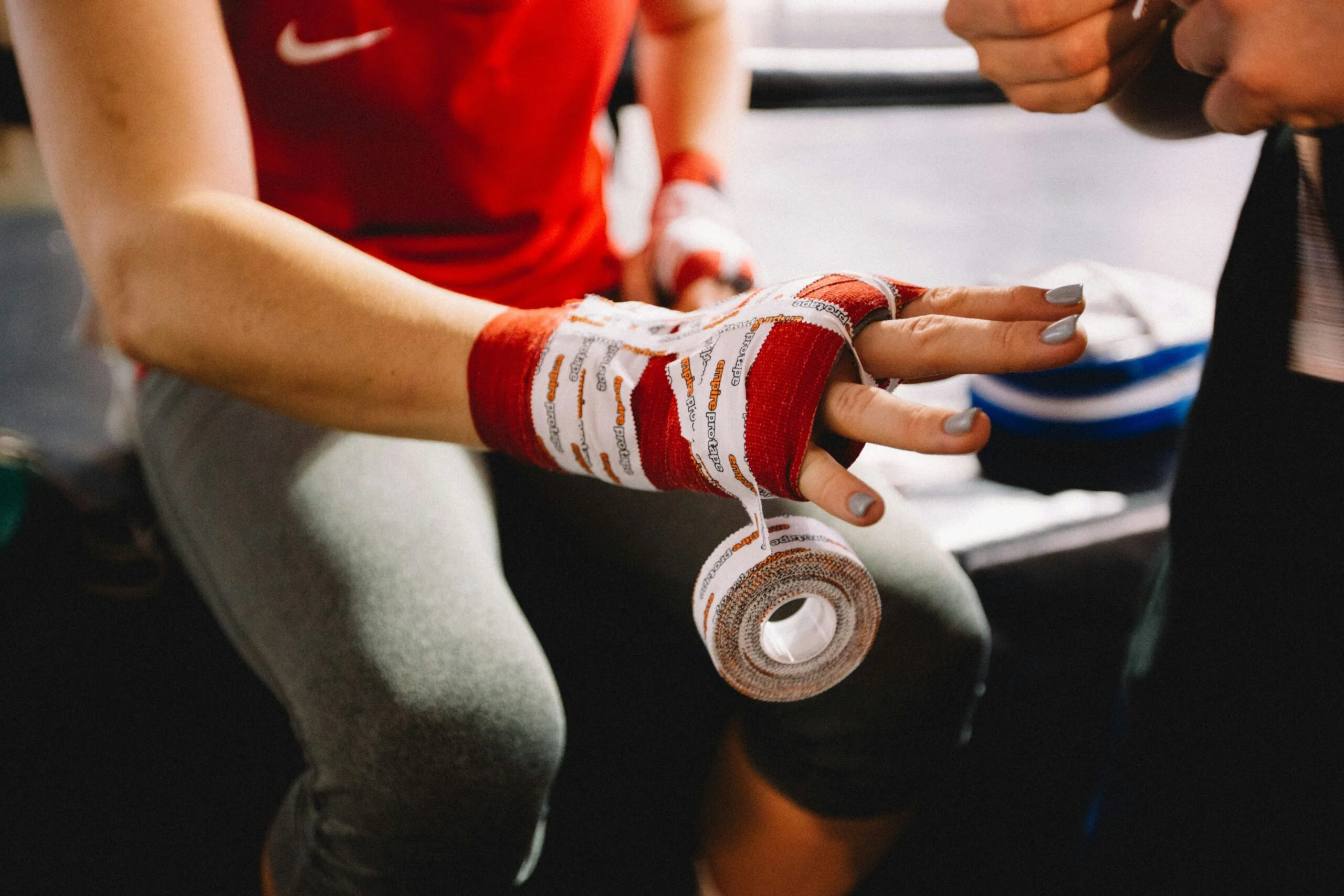 person wrapping bandage, martial arts wrapping products